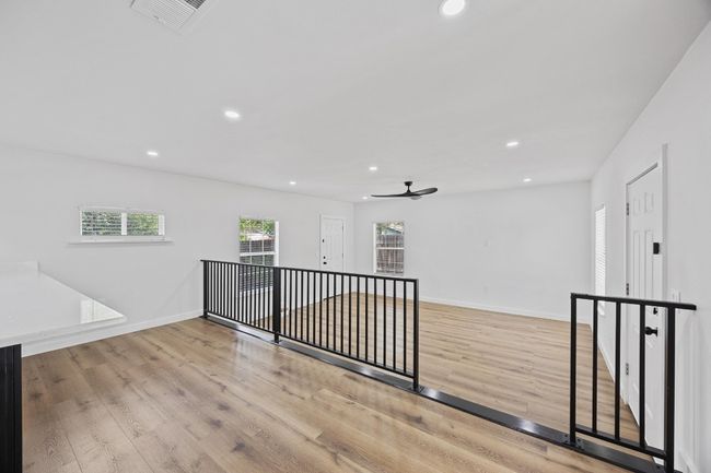 Spare room featuring recessed lighting, wood finished floors, and a ceiling fan | Image 11