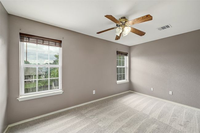 Unfurnished room featuring carpet floors and a ceiling fan | Image 23