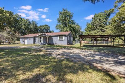 Ranch-style house featuring a front lawn | Image 2