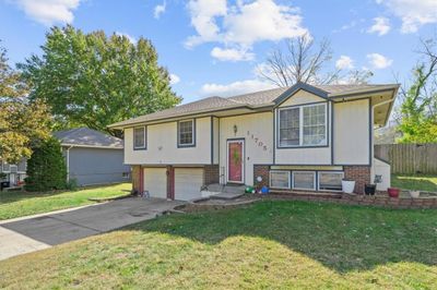 Raised ranch featuring a front lawn and a garage | Image 3