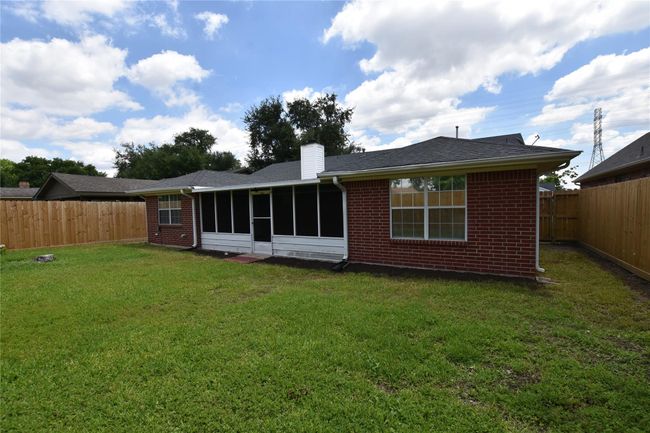 This tranquil backyard offers a private oasis, perfect for relaxation and outdoor activities. | Image 28