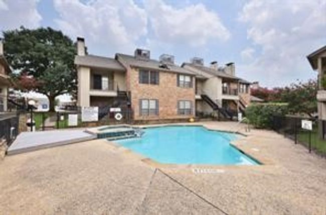 Pool featuring a community hot tub, a patio, and fence | Image 5