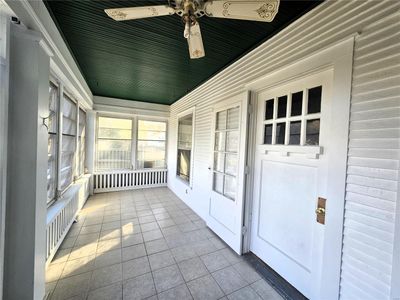 Unfurnished sunroom with ceiling fan | Image 2