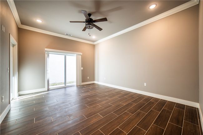 Primary suite looking toward sliding glass doors | Image 24