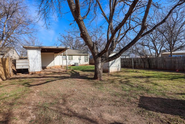 View of yard with an outbuilding, central AC, and a fenced backyard | Image 28