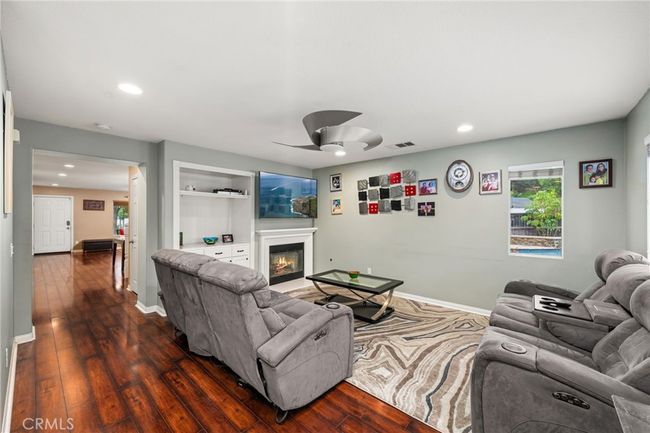 Family Area with Hall to Stairs and Living/Dining Areas | Image 15