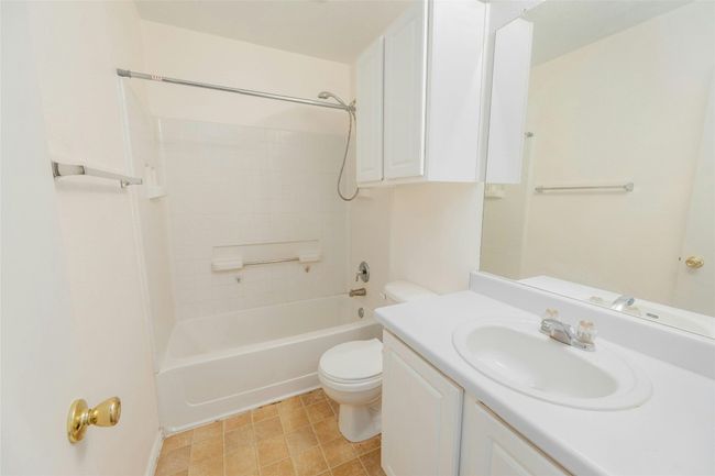 Full bathroom featuring toilet, vanity, and bathtub / shower combination | Image 14