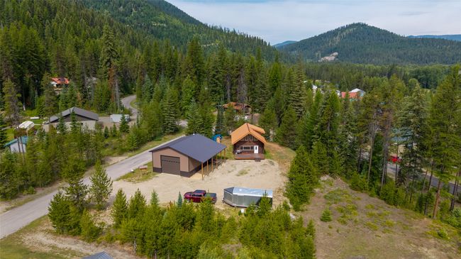 View of subject property with a heavily wooded area and a mountain backdrop | Image 5
