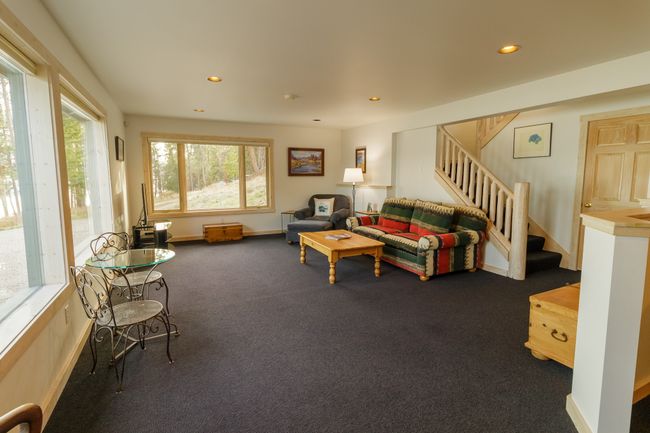 Living room featuring dark colored carpet | Image 35