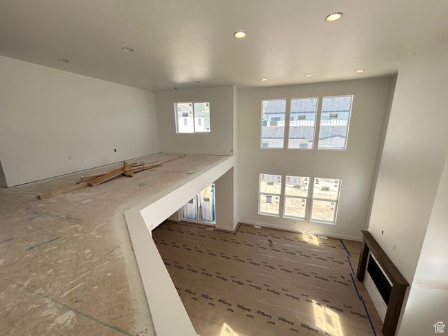 Unfurnished living room featuring plenty of natural light and recessed lighting | Image 9