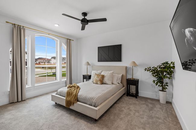 Bedroom with carpet flooring and ceiling fan | Image 17
