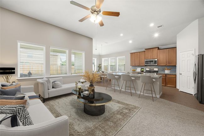 Gather, relax, and entertain with ease in this open-concept living space featuring an airy layout and abundant natural light. *Virtually Staged | Image 5