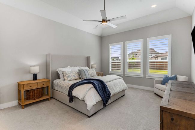 Plantation shutters in primary suite open to the backyard view! | Image 15