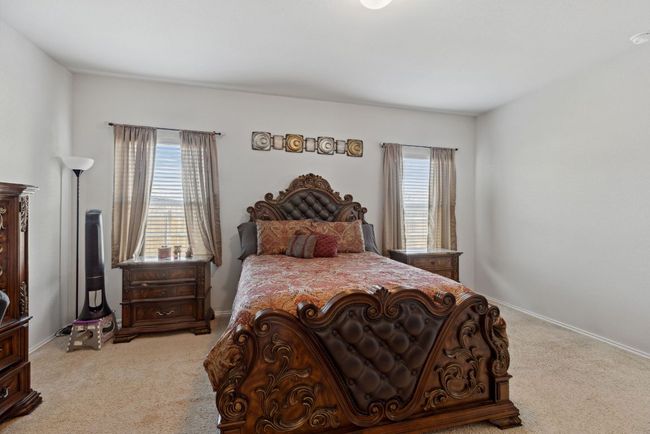 Carpeted bedroom with baseboards | Image 29