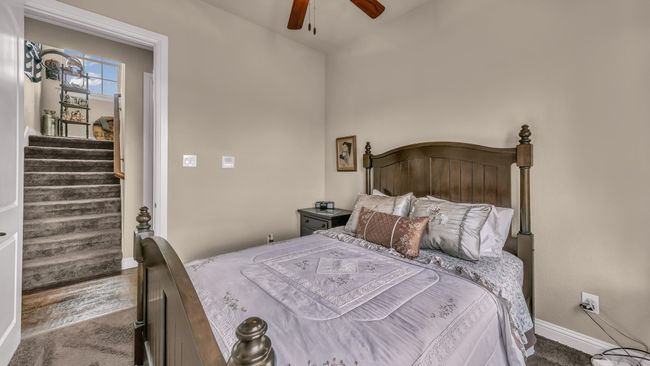 Carpeted bedroom featuring baseboards and a ceiling fan | Image 32