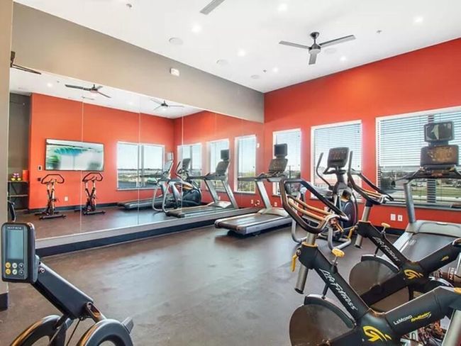 Exercise room featuring ceiling fan | Image 17