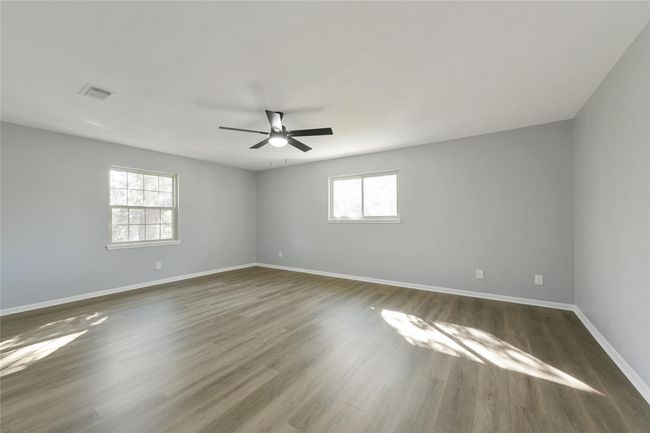 Primary Bedroom with nice light and wood type floors | Image 18
