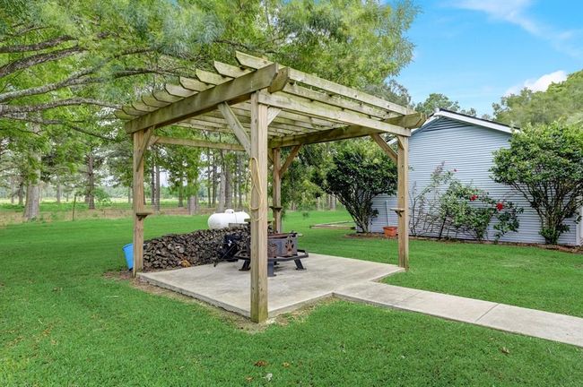 Outdoor fire pit and pergola for summer night fires and stores. | Image 23