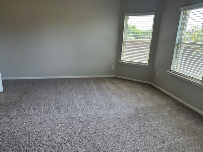 Spacious master bedroom with a great amount of natural light | Image 11