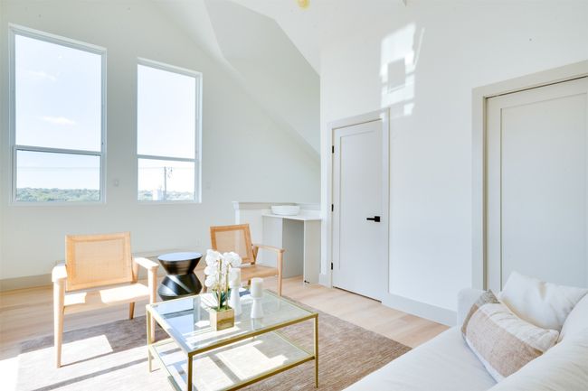 Living area with lofted ceiling and light wood-type flooring | Image 30