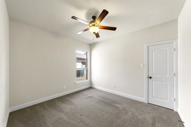 Second Bedroom with spacious walk-in closet and ceiling fan. | Image 18