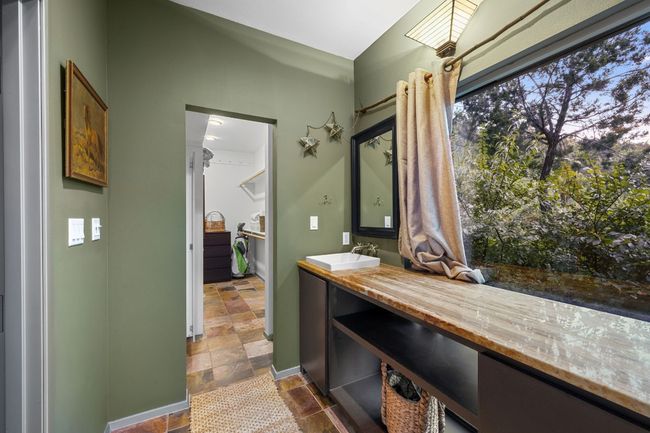 Stone remnant counter and glass wall to let light in! | Image 34