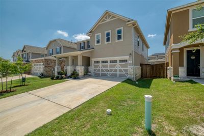 Captivating curb appeal welcomes you with a charming stone and stucco facade, setting the tone for the elegance within. | Image 3