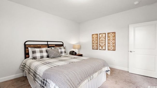 Bedroom with carpet flooring and baseboards | Image 29