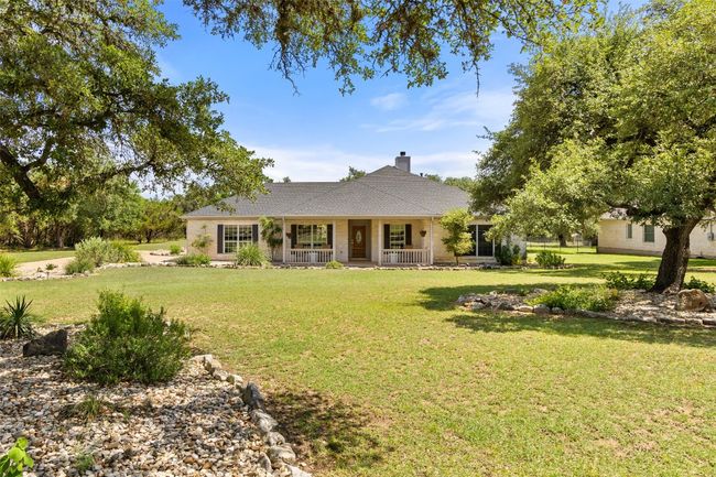 The home is situated back on the property offering nice privacy. | Image 38