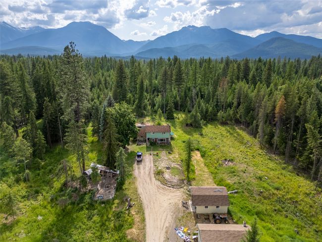 Bird's eye view of mountains and a heavily wooded area | Image 23