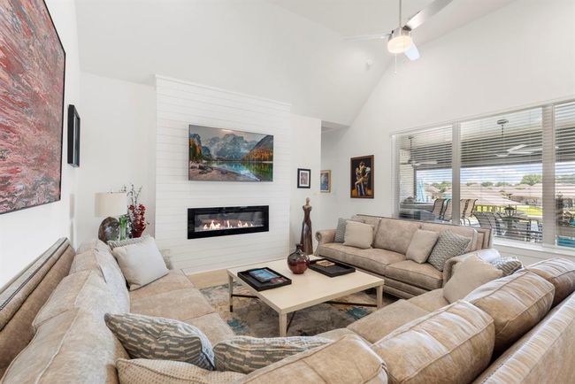 Cozy up by the gas fireplace with easy electric start—ideal for chilly evenings. | Image 24