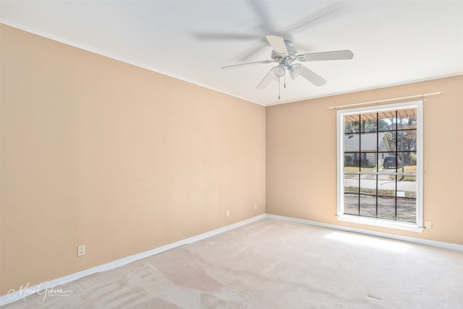 Spare room with light carpet, a ceiling fan, baseboards, and ornamental molding | Image 14