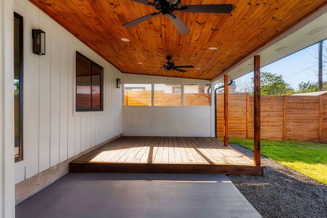 Large covered patio with cedar slats, fans and recessed lighting on ceiling. | Image 32