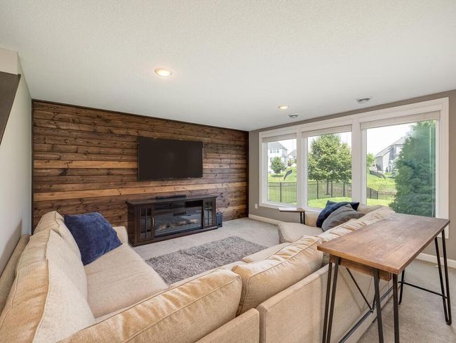 Lower level family room with floor to ceiling windows! | Image 23