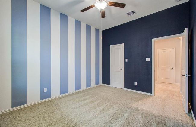 Another view of upstairs bedroom. Door on left is to the walk in closet. | Image 28