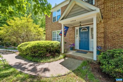 View of the front of the property, with beautiful custom quoin masonry. | Image 1