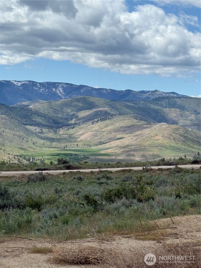 Property extends beyond the road on each side of the property. | Image 16