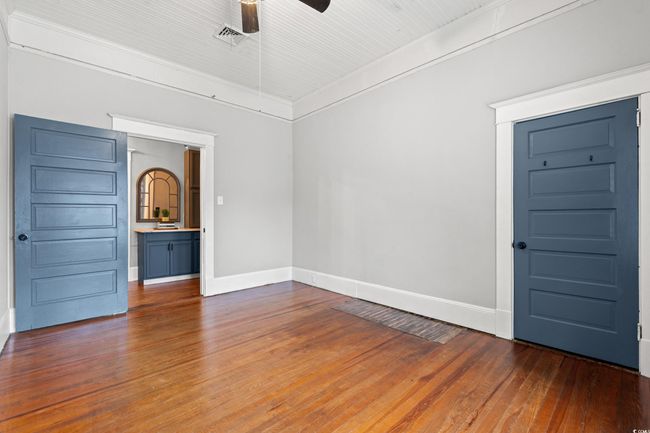 Empty room featuring wood-type flooring and a ceiling fan | Image 23