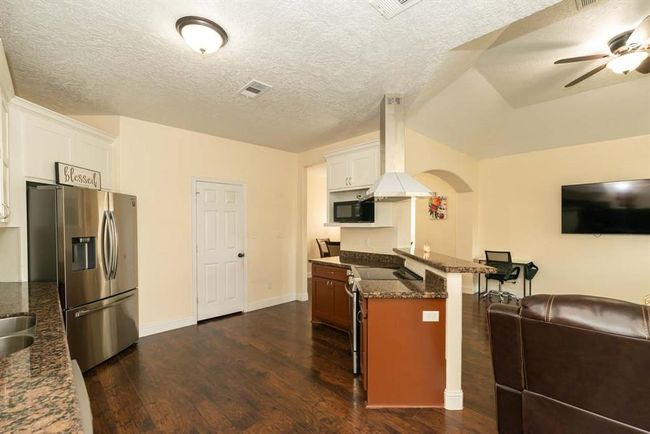 8040 Honeywood Trl, Home with 3 bedrooms, 2 bathrooms and null parking in Nederland TX | Image 7