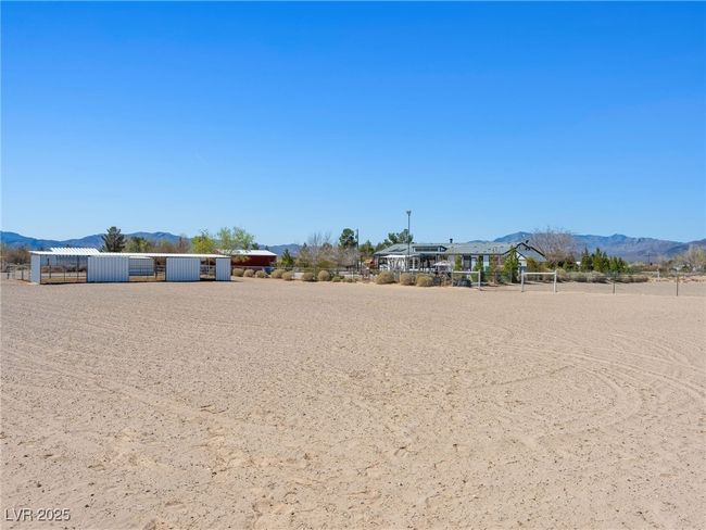 View of yard with a mountain view and an outdoor structure | Image 65