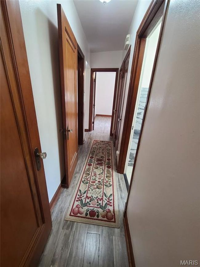 Corridor with wood finished floors | Image 12