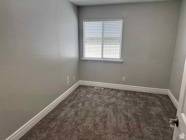 Carpeted spare room with baseboards | Image 12