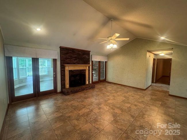 Gas log Brick Fireplace and vaulted ceilings | Image 6