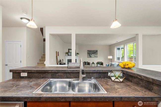 sprawling kitchen/dining area flows seamlessly out to the back patio and into the large living room! | Image 14