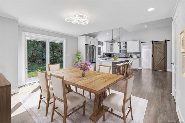 Virtual staged open concept dining area. | Image 16