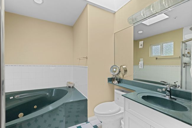Full bath with a jetted tub and vanity | Image 20