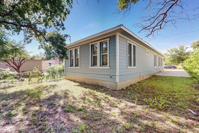 View of home's exterior with fence | Image 16