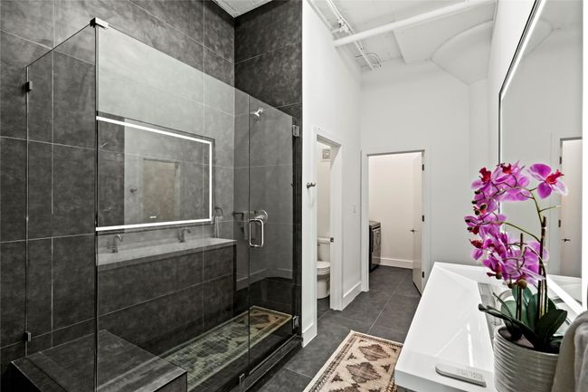 Full bathroom with toilet, a shower stall, and vanity | Image 26