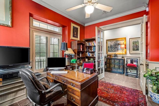 Study looking onto the front hallway. One can work in quiet behind the French Doors, and still enjoy having visitors in the home while getting work done. | Image 22