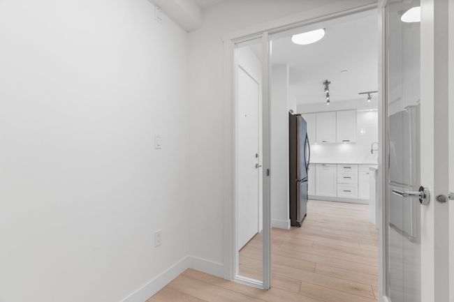 Corridor featuring light wood-type flooring and baseboards | Image 17